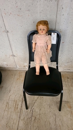 Doll and Black Chair