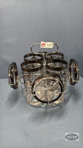 (4) 25TH ANN. GLASSES WITH COASTERS AND WIRE STAND