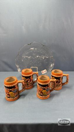 11IN GLASS PLATE WITH (4) PORCELAIN 5IN TALL STEINS