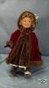 SKATER DOLL WITH PORCELAIN HEAD ON STAND