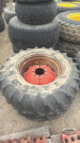 Pair of 14.9 24 tires on case 8 bolt wheels