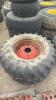 Pair of 14.9 24 tires on case 8 bolt wheels