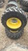 Pair of 12-16.5 tires on Jd 8 bolt wheels