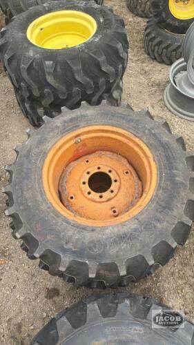 Pair of 13.6-24 Firestone tires on case 8 bolt wheels