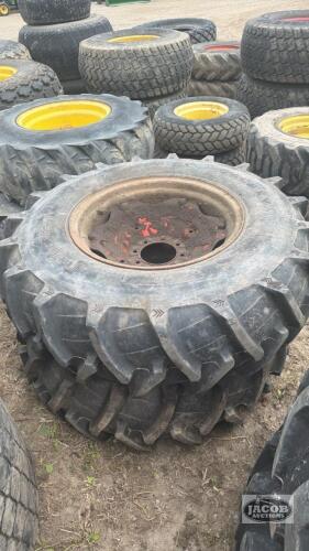 Pair of 14.9 24 tires on case 8 bolt wheels