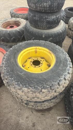 Pair of 16.9 24 tires on Jd 8 bolt wheels