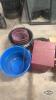 Pile of feed/water buckets and storage box