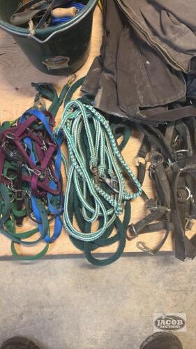 3 piles of horse harness and leads