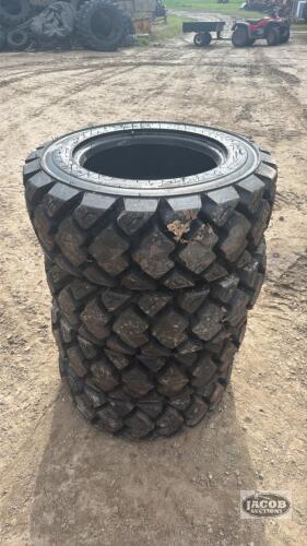 Unused 10-16.5 skid steer tire x4