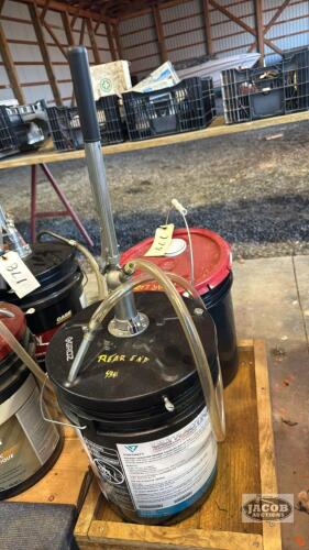 2 OIL PAILS WITH 1 HAND PUMP