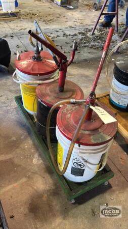 3 OIL PAILS WITH HAND PUMPS