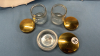 3 Dresser Jars with Gold Coloured Lids on 2 Plates - 3