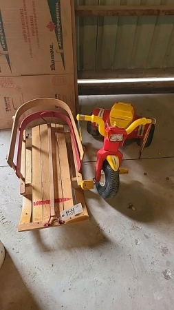 Wooden child sleigh and tricycle