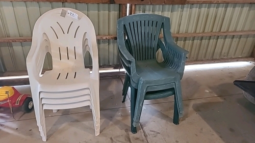 Seven poly stacking patio chairs