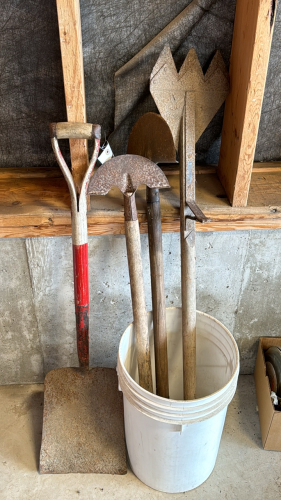 Shovel, two edgers, and a hay knife