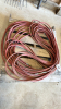 Large quantity of red air hose