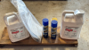 Two jugs of herbicide, two cans of wasp killer, seed treatment kit