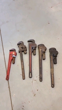 Five pipe wrenches