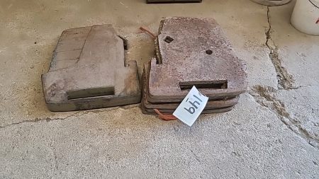 One Ford suitcase, weight, and six home cut weights