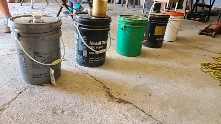 Five pails of lubricants