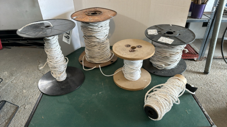 5 partial spools of electric fencing