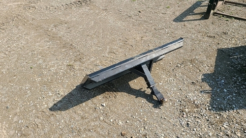 Trailer hitch mounted on skid steer plate