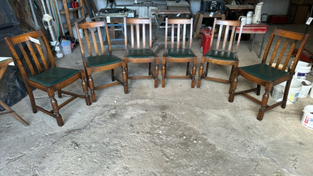 Set of six wooden chairs with green seats