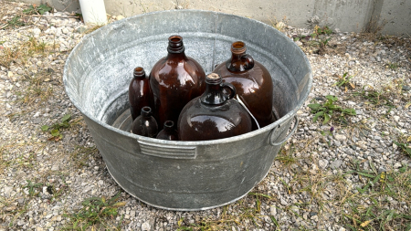 Round Galvanized Wash Tub with qty of Amber Jugs